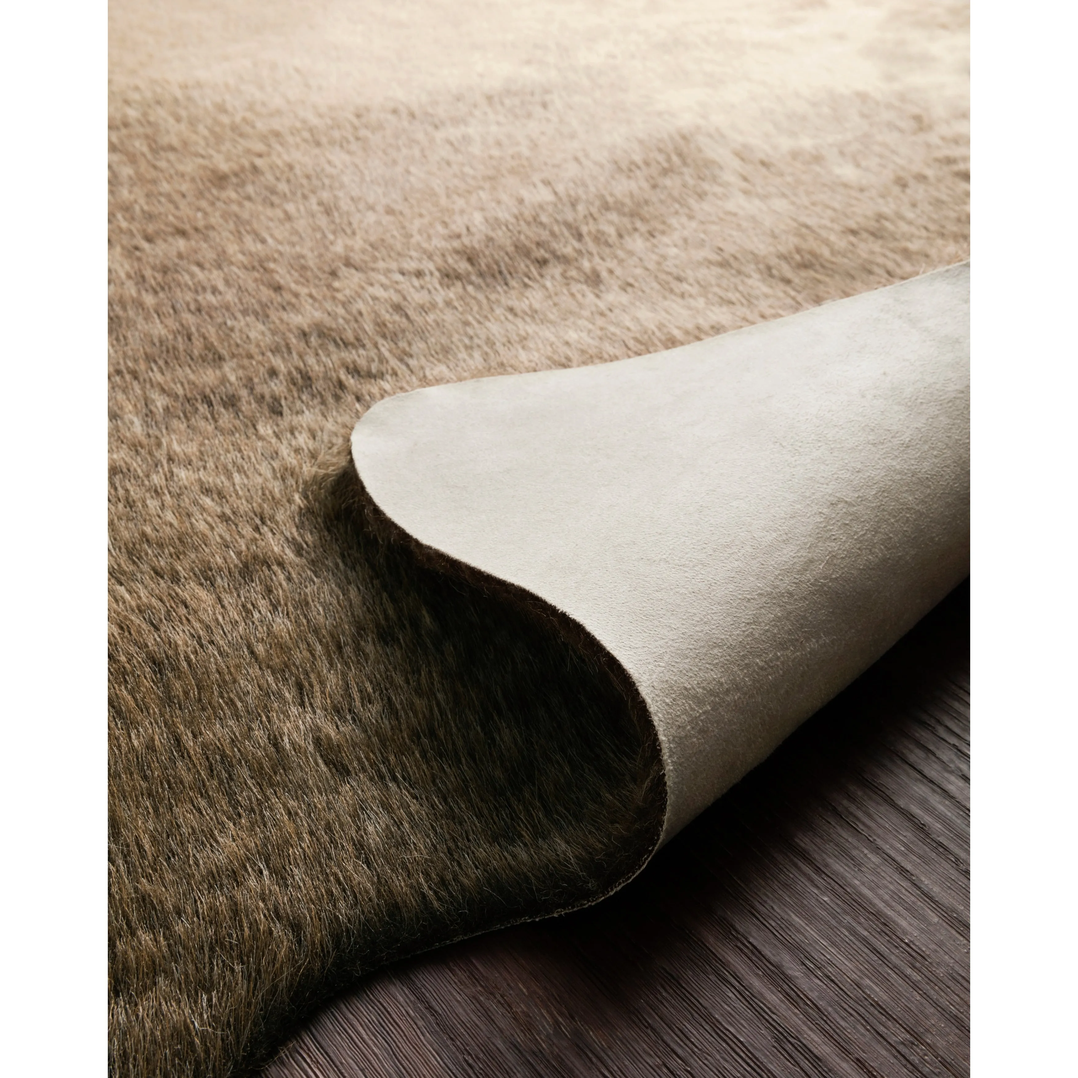 Alexander Home Faux Cowhide Area Rug