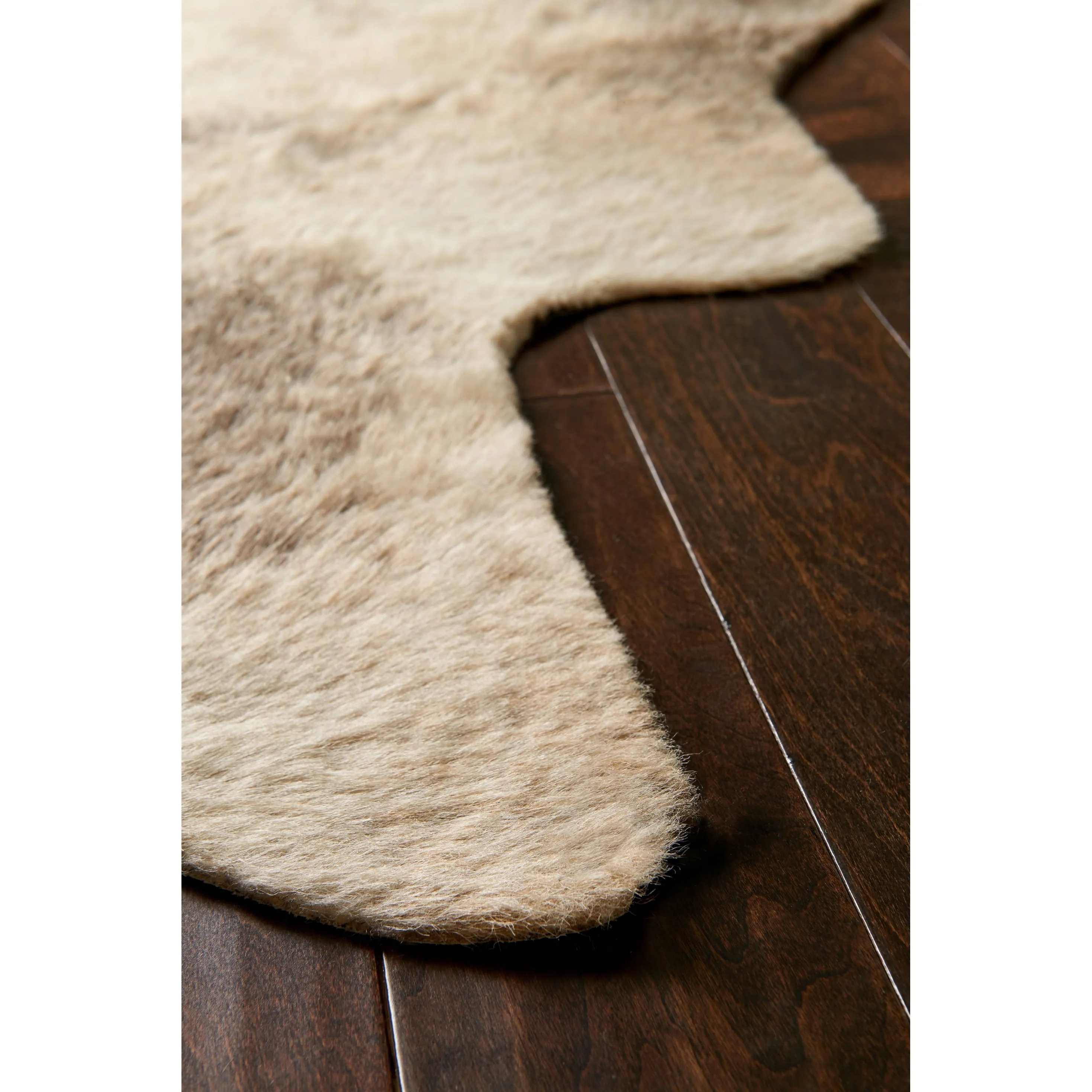 Alexander Home Faux Cowhide Area Rug