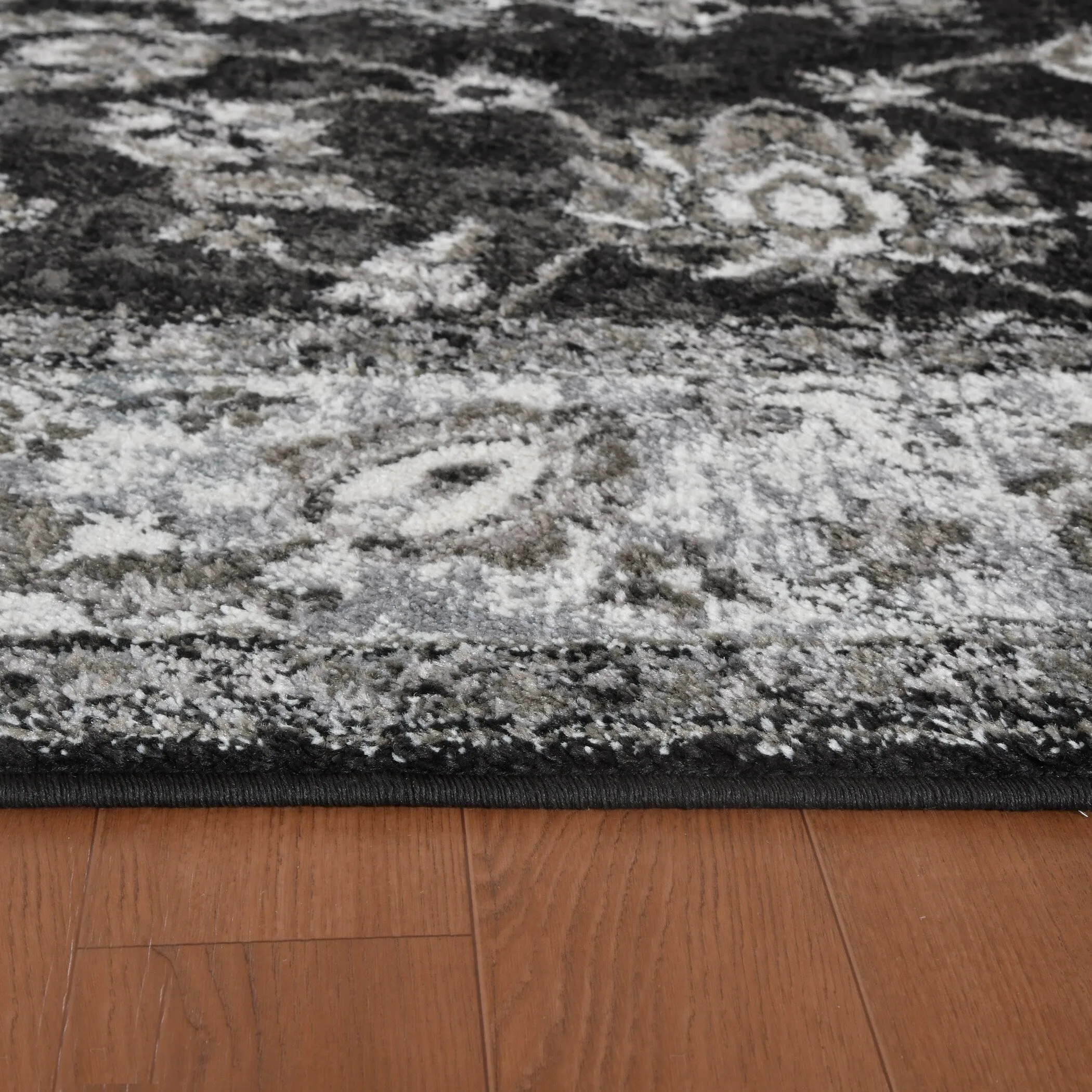 Aurelia Jiru Black Bordered Area Rug