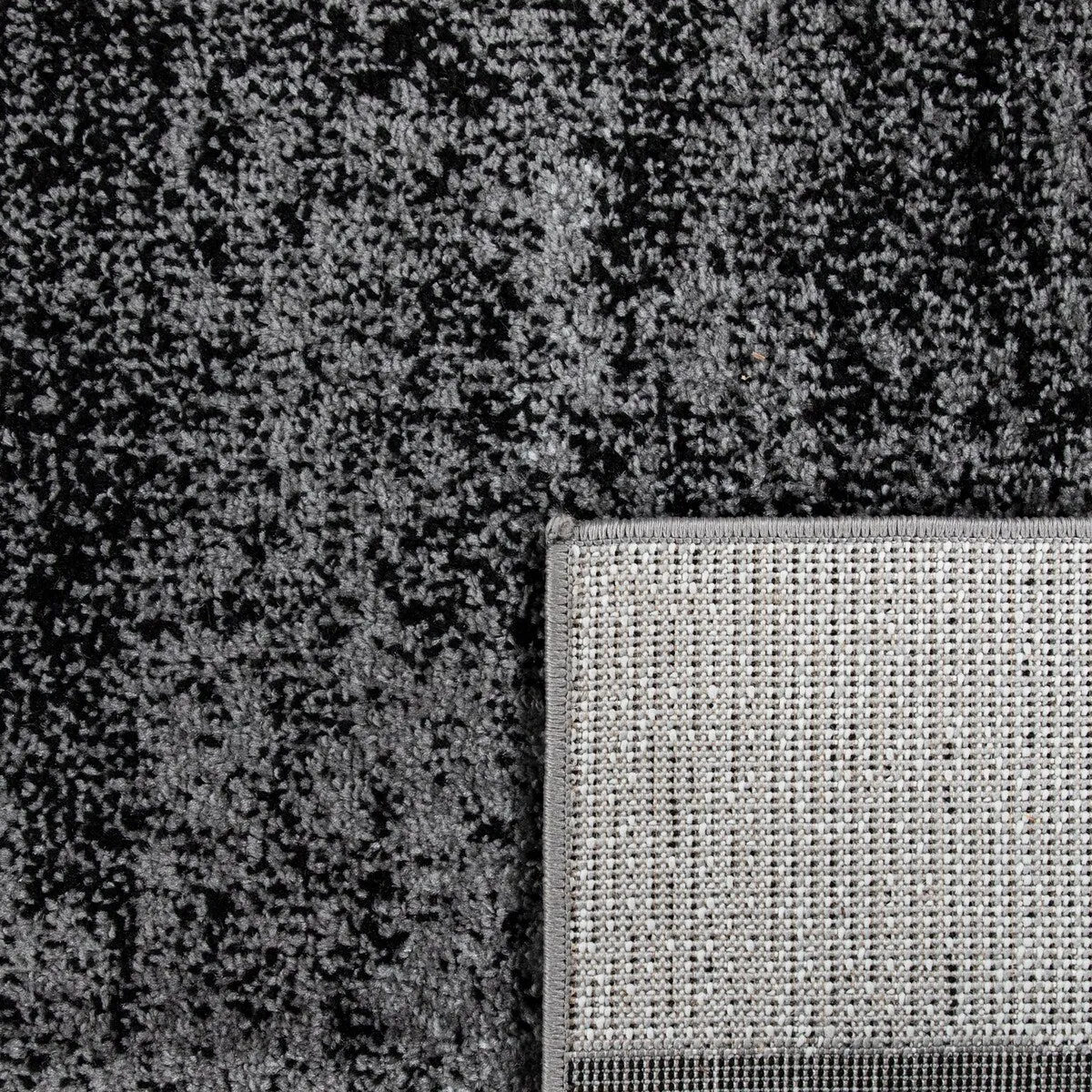 Black White Area Rug with Geometric Pattern and Modern Paint Effect