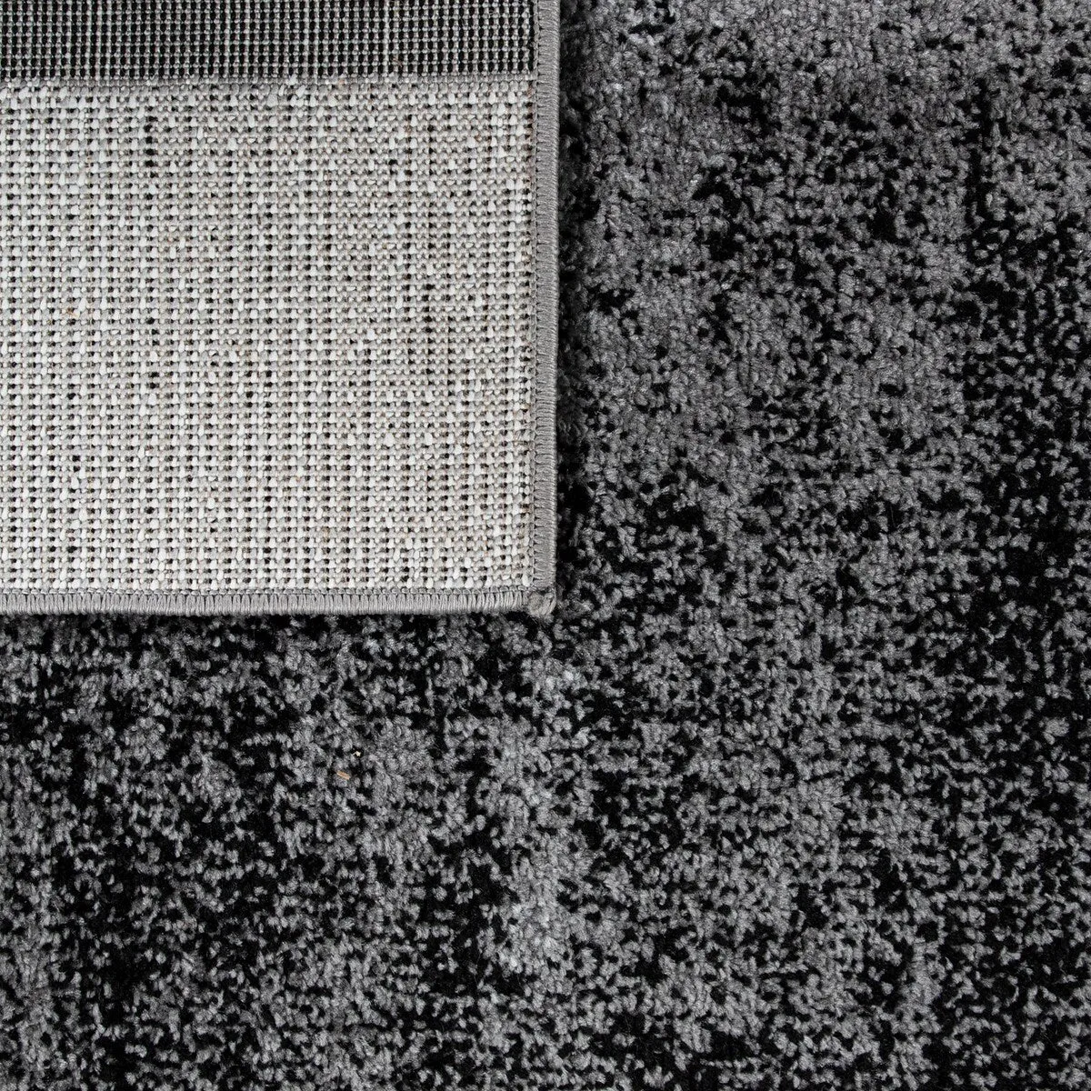 Black White Area Rug with Geometric Pattern and Modern Paint Effect