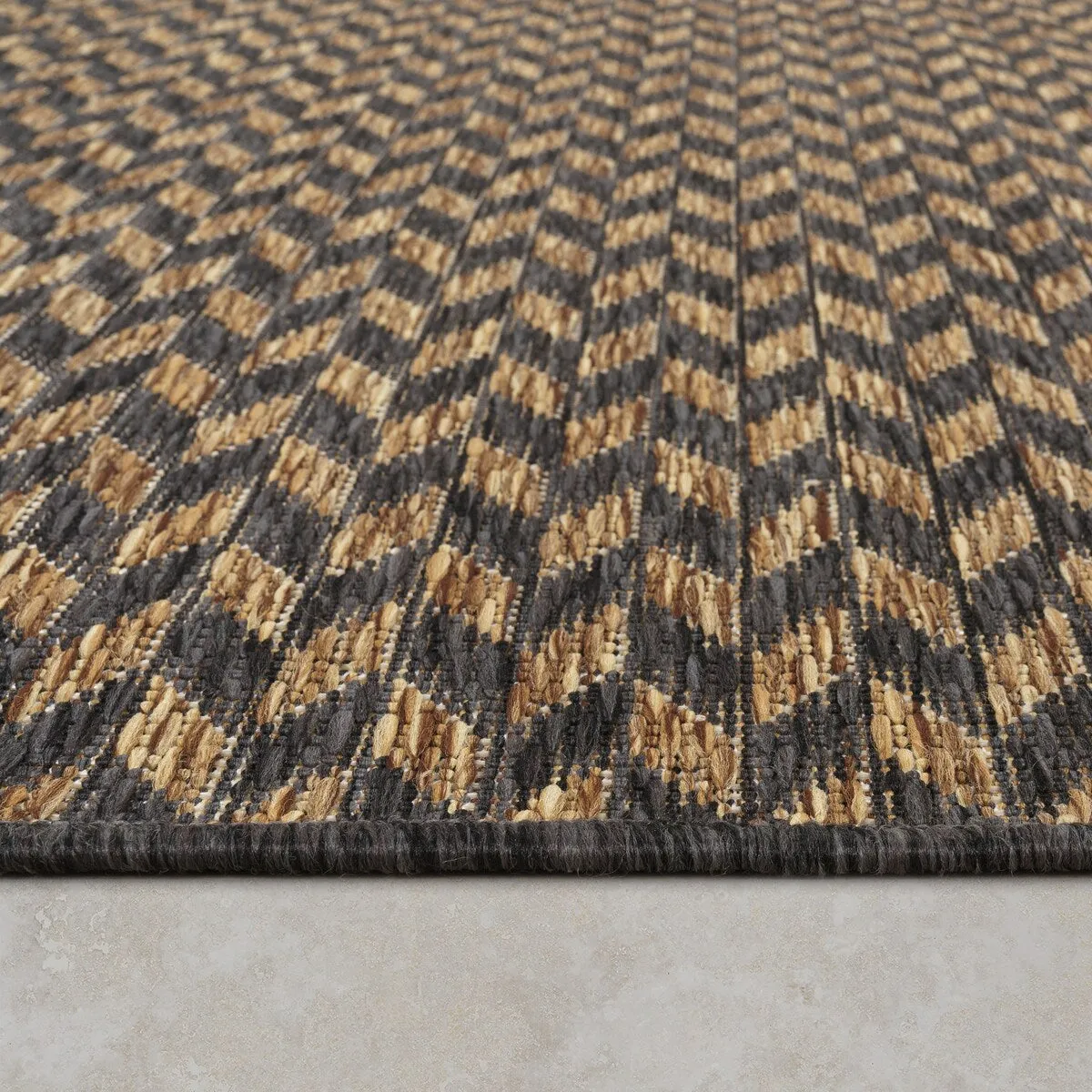 Indoor & Outdoor Rug with Boho Herringbone Pattern in Black and Brown