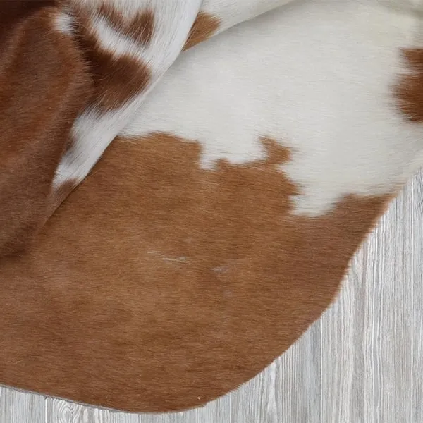 Real Brown and White Cowhide Rug (7' x 6')